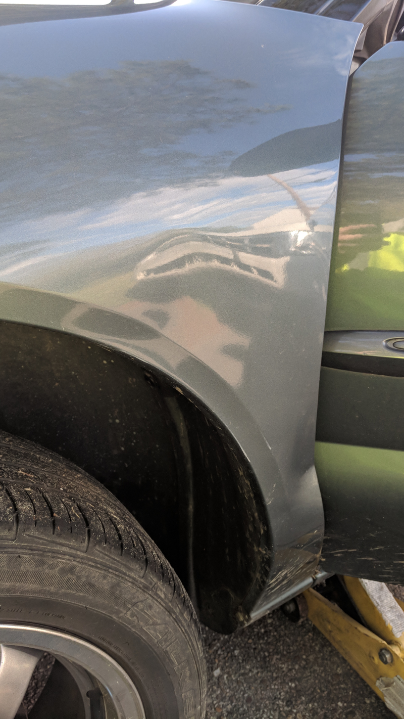 The target. The nice pressed in dent, the one giving the Escape a grumpy face.